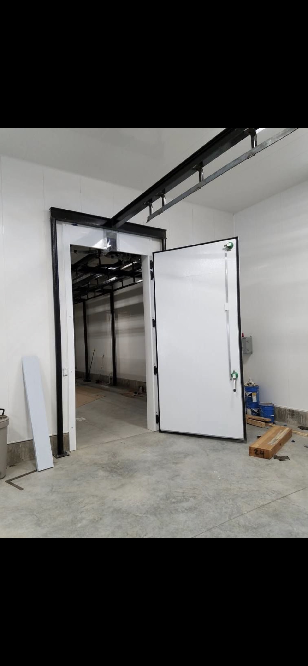 Large commercial door installation at butcher plant